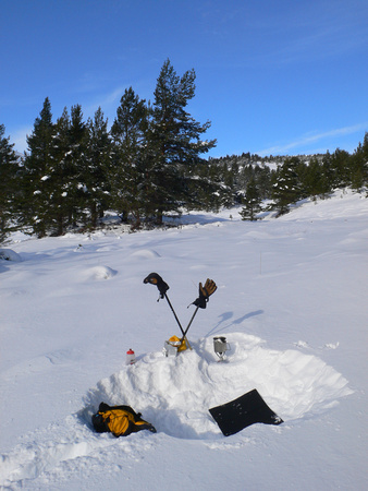 After scrapping the idea of climbing a hill, digging a snowhole seemed a good idea!